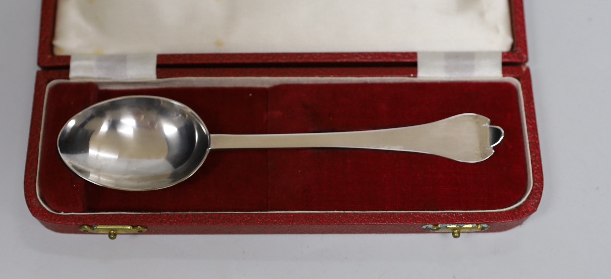 Three cased sets of silver flatware including a 1953 Commemorative dog nose spoon, six teaspoons and six tea knives.